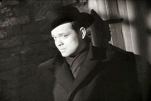 The Third Man. A light illuminates Harry Lime's face, and Orson Welles's smug, villainous mug makes its first appearance in this film.