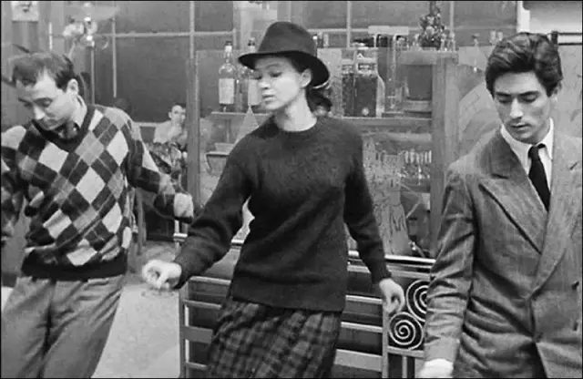 Odile, Franz, and Arthur dance The Madison in a cafe. Odile wears a fedora.